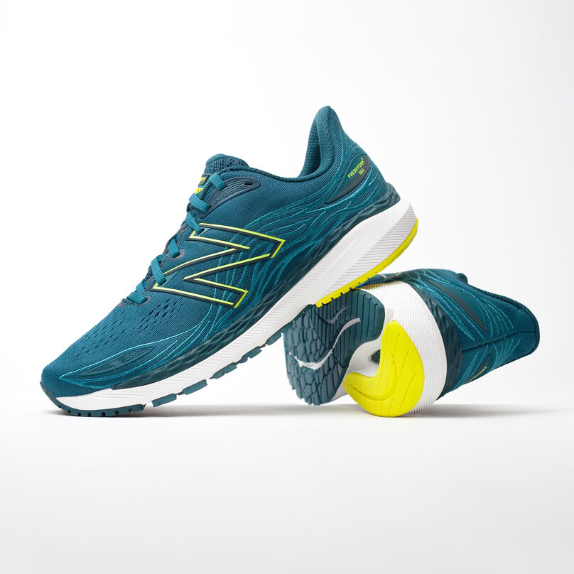Left pair, side profile of dark green Fresh Foam 860v12, resting on the heel of the right pair with heel facing front