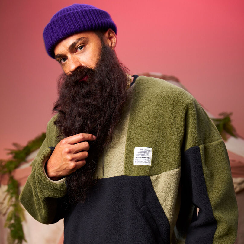 Man wearing the Salehe Apparel Collection cropped from waist up.