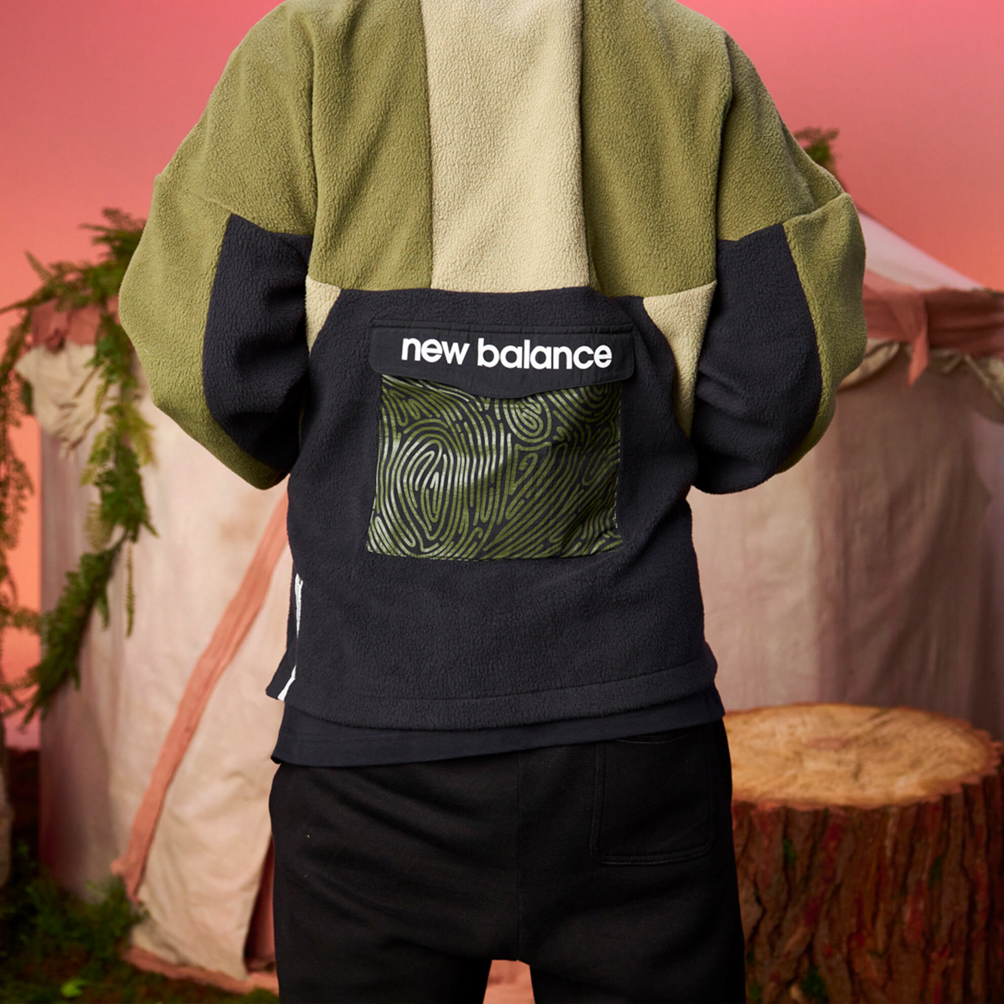 Cropped in image on a model’s back wearing a Salehe Apparels Collection fleece.