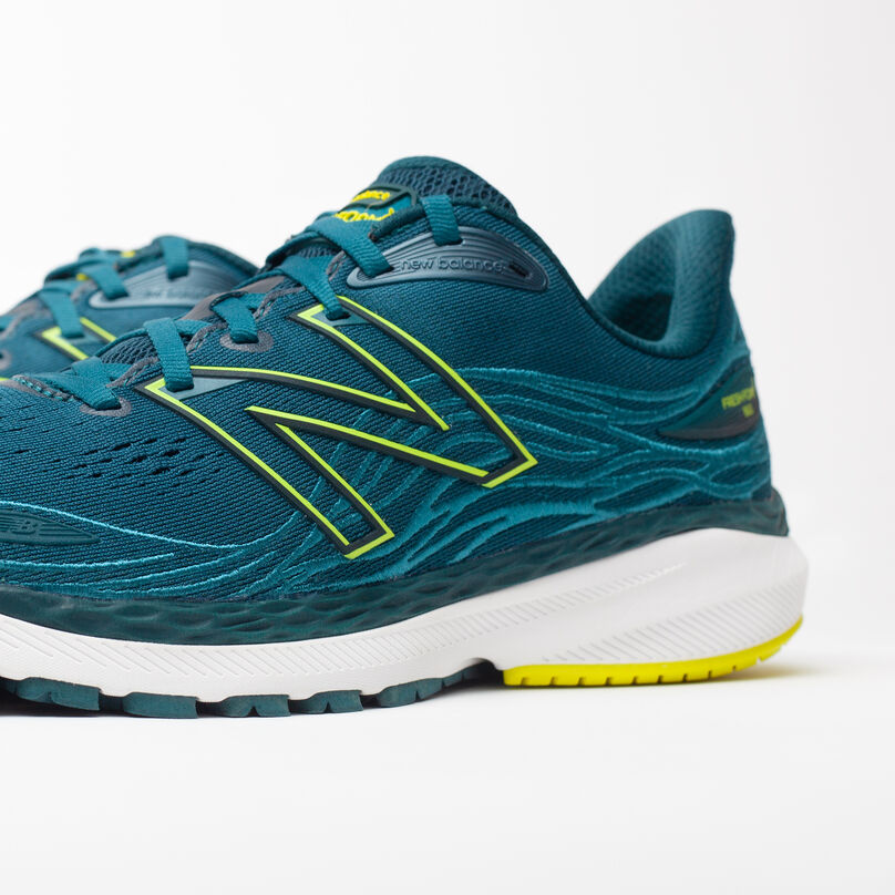 Zoomed in, side profile of dark green Fresh Foam 860v12 with front upper cropped